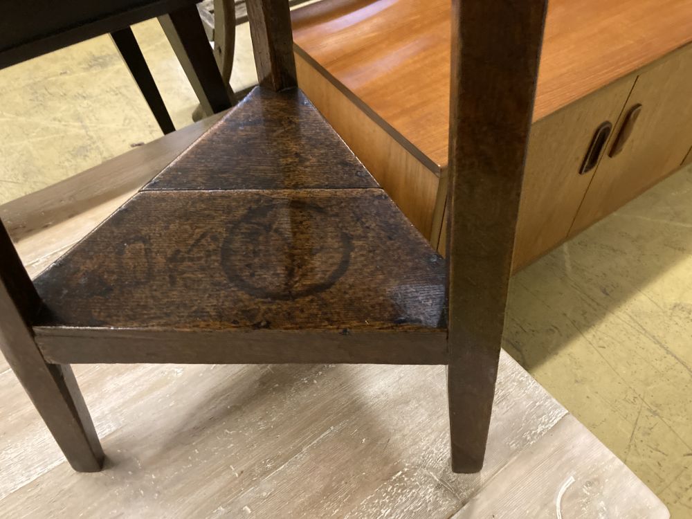 A small 18th century oak cricket table, with understage, 48cm diameter, height 70cm